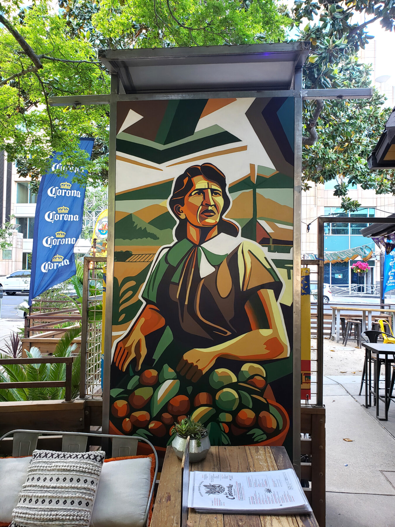 Modern Cubist-Abstract Cesar Chavez mural in an outdoor courtyard setting.