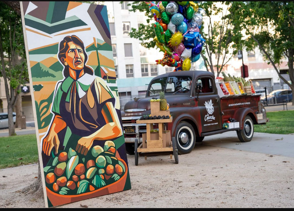 Chicano mural on plywood at Cesar Chavez plaza