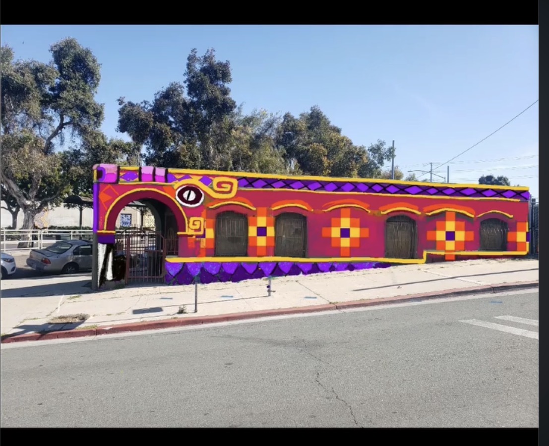 A vibrant Chicano mural of Quetzalcoatl wrapped around the triangular architecture of Galeria 1904 in San Diego